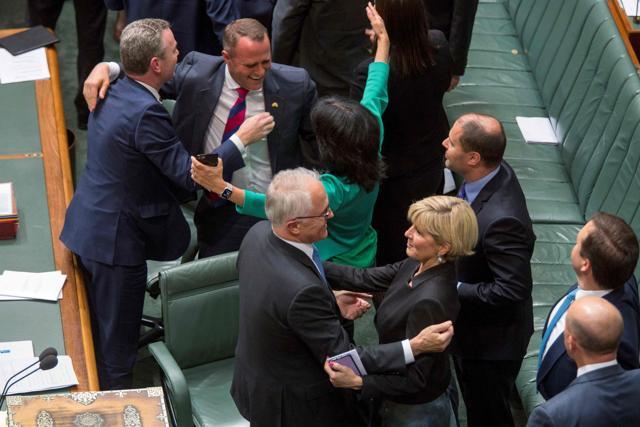 Australia's Prime Minister Malcolm Turnbull (front L), Foreign Minister Julie Bishop (front R) and other members of Parliament embrace after parliament passed the same-sex marriage bill in the Federal Parliament in Canberra on December 7. (AFP Photo) Australia's Prime Minister Malcolm Turnbull (front L), Foreign Minister Julie Bishop (front R) and other members of Parliament embrace after parliament passed the same-sex marriage bill in the Federal Parliament in Canberra on December 7. (AFP Photo)
