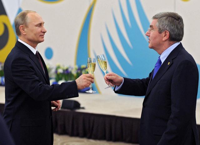 In this Feb. 24, 2014 file photo Russian President Vladimir Putin, left, toasts a glass of champagne with the International Olympic Committee president Thomas Bach during the official reception of IOC for Sochi 2014 Winter Olympics organizing committee in Sochi. (AP) In this Feb. 24, 2014 file photo Russian President Vladimir Putin, left, toasts a glass of champagne with the International Olympic Committee president Thomas Bach during the official reception of IOC for Sochi 2014 Winter Olympics organizing committee in Sochi. (AP)