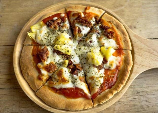 The pizza’s humble ancestor, a plain affair usually tarted up with a bit of lard, was born less as an act of love than as a cheap, easy and fast way to feed the city’s poor in the 18th century. (Shutterstock) The pizza’s humble ancestor, a plain affair usually tarted up with a bit of lard, was born less as an act of love than as a cheap, easy and fast way to feed the city’s poor in the 18th century. (Shutterstock)