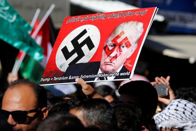 A protester holds a sign with Donald Trump picture during a protest against Trump's recognition of Jerusalem as Israel's capital, in Amman, Jordan. (Reuters Photo) A protester holds a sign with Donald Trump picture during a protest against Trump's recognition of Jerusalem as Israel's capital, in Amman, Jordan. (Reuters Photo)