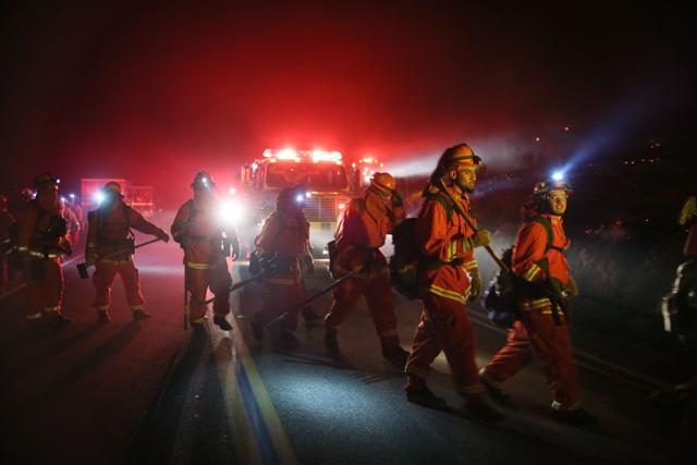 Firefighters prepare to battle the Lilac fire in Bonsall. (AFP Photo)