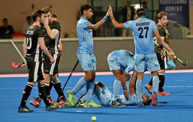 Indian hockey team players celebrate after SV Sunil (lying on the ground) scored against Germany, during their third place play-off match of the Hockey World League Final at Kalinga Stadium in Bhubaneswar on Sunday. Get highlights of India vs Germany Hockey World League Final third place play-off below. (PTI) Indian hockey team players celebrate after SV Sunil (lying on the ground) scored against Germany, during their third place play-off match of the Hockey World League Final at Kalinga Stadium in Bhubaneswar on Sunday. Get highlights of India vs Germany Hockey World League Final third place play-off below. (PTI)