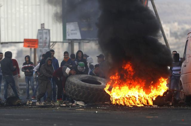 Palestinians burn tires during clashes with Israeli troops following a protest against US President Donald Trump's decision to recognize Jerusalem as the capital of Israel, in the West Bank City of Nablus, Sunday, Dec. 10, 2017. (AP) Palestinians burn tires during clashes with Israeli troops following a protest against US President Donald Trump's decision to recognize Jerusalem as the capital of Israel, in the West Bank City of Nablus, Sunday, Dec. 10, 2017. (AP)