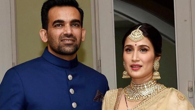 Zaheer Khan with his wife Sagarika Ghatge pose for photographers before his reception party in Mumbai last month. (Twitter)