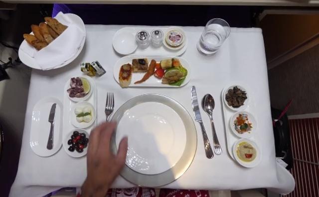 The food spread on board the flight. (Youtube.com)