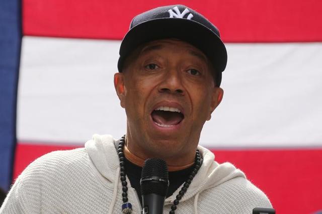 Producer Russell Simmons take part in an "I am Muslim Too" rally in Times Square Manhattan. Producer Russell Simmons take part in an "I am Muslim Too" rally in Times Square Manhattan.