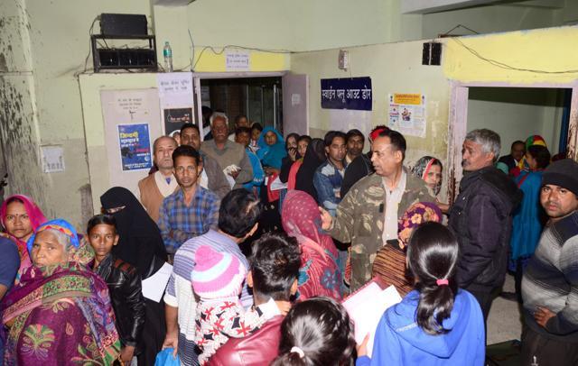 Patients wait for their turn at Kanwatia Hospital on Saturday. (Prabhakar Sharma/HT Photo)