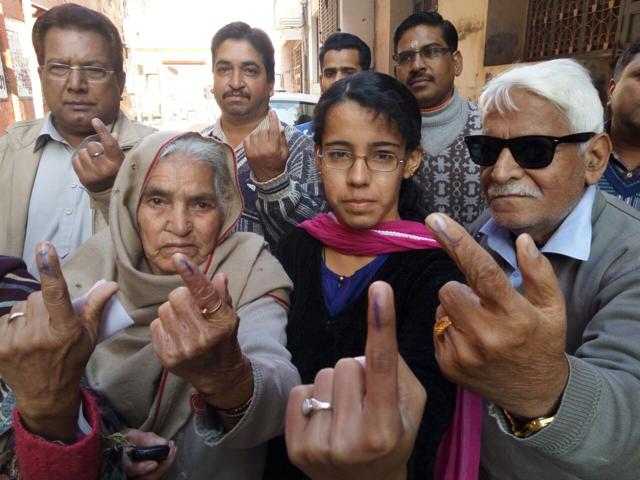 Three generation after voting stand outside a polling booth in Patiala. (Bharat Bhushan Sharma /HT) Three generation after voting stand outside a polling booth in Patiala. (Bharat Bhushan Sharma /HT)