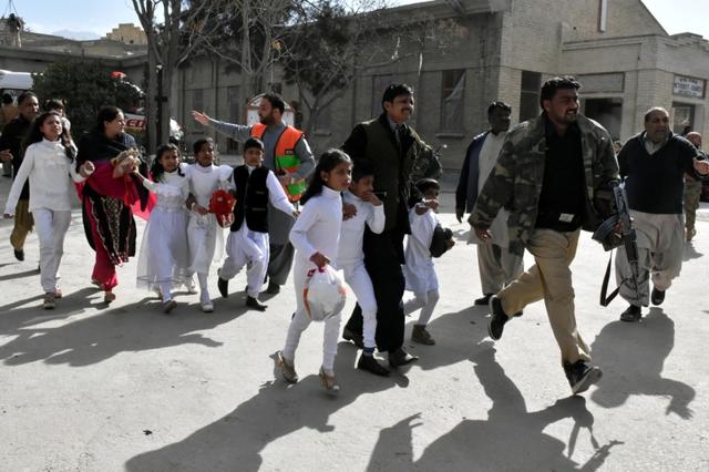 Policemen guide people after gunmen attacked the Bethel Memorial Methodist Church in Quetta, Pakistan on December 17, 2017. (Reuters) Policemen guide people after gunmen attacked the Bethel Memorial Methodist Church in Quetta, Pakistan on December 17, 2017. (Reuters)