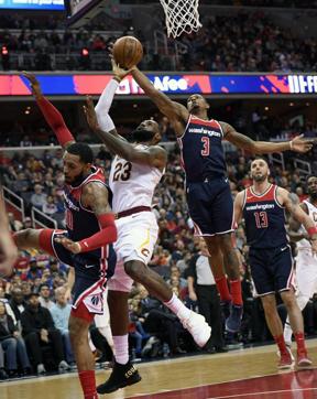 Cleveland Cavaliers forward LeBron James (23) goes to the basket against Washington Wizards during the first half of an NBA basketball game, Sunday, Dec. 17, 2017, in Washington. (AP) Cleveland Cavaliers forward LeBron James (23) goes to the basket against Washington Wizards during the first half of an NBA basketball game, Sunday, Dec. 17, 2017, in Washington. (AP)