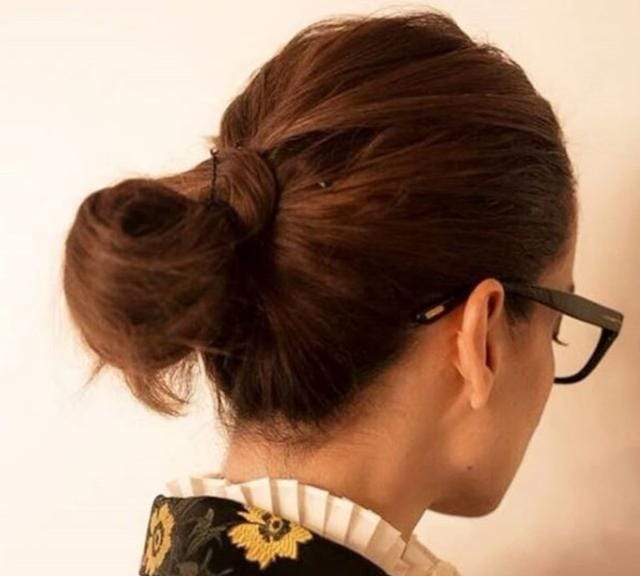 Kangana kept her make-up minimal and went with a messy low-bun. (Instagram)