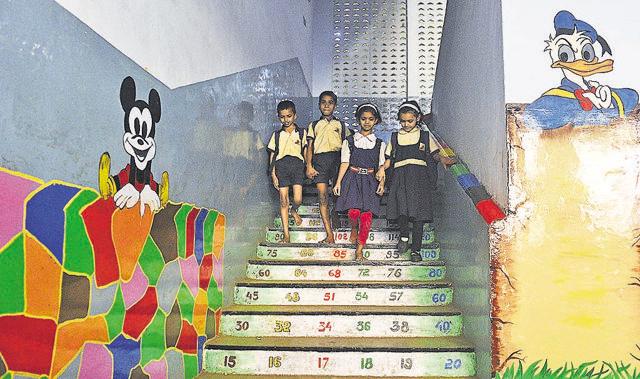 Students walk down a painted staircase at Vidya Niketan school in Kothrud on Friday. (Pratham Gokhale/HT Photo) Students walk down a painted staircase at Vidya Niketan school in Kothrud on Friday. (Pratham Gokhale/HT Photo)