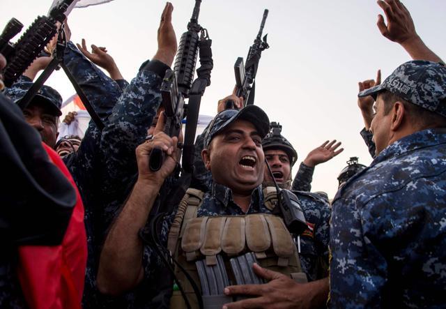 Members of the Iraqi federal police celebrate in the Old City of Mosul after the government's announcement of the "liberation" of the city from the Islamic State on July 10, 2017. (AFP) Members of the Iraqi federal police celebrate in the Old City of Mosul after the government's announcement of the "liberation" of the city from the Islamic State on July 10, 2017. (AFP)