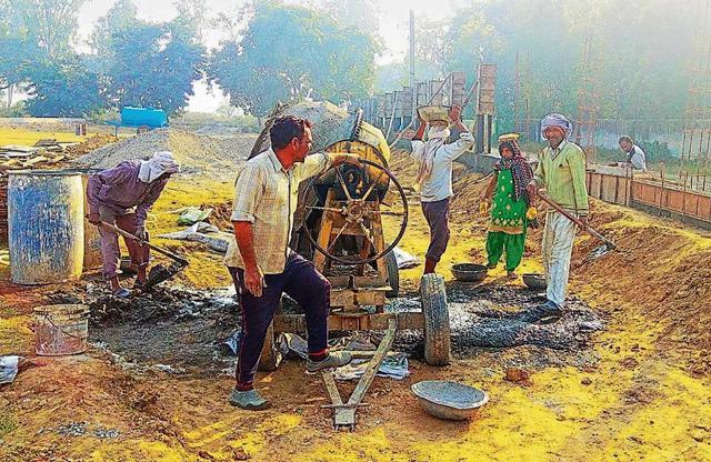 Workers building the boundary wall of the Mahabharata Museum in Kurukshetra. (HT Photo) Workers building the boundary wall of the Mahabharata Museum in Kurukshetra. (HT Photo)