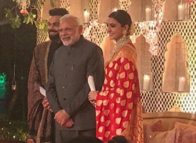 Prime Minister Narendra Modi poses with Virat Kohli and Anushka Sharma at their wedding reception. (Twitter) Prime Minister Narendra Modi poses with Virat Kohli and Anushka Sharma at their wedding reception. (Twitter)