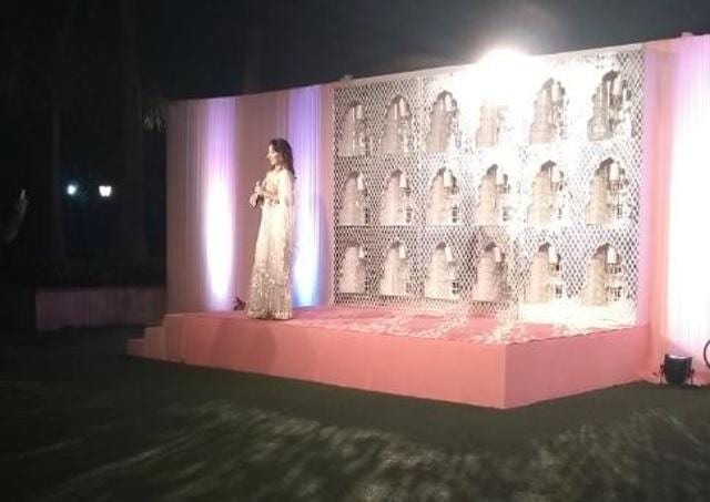 Anchor announcing the arrival of the newly-wed couple for the media.