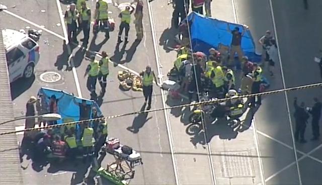 Police and emergency services attend to the scene of an incident involving a vehicle on Flinders Street. (REUTERS) Police and emergency services attend to the scene of an incident involving a vehicle on Flinders Street. (REUTERS)