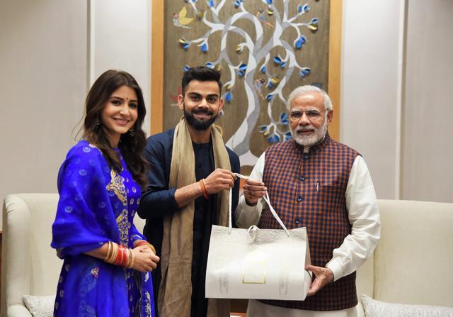 Anushka Sharma (L) and Virat Kohli (R) had married in Italy on December 11. (Twitter/PMOIndia)