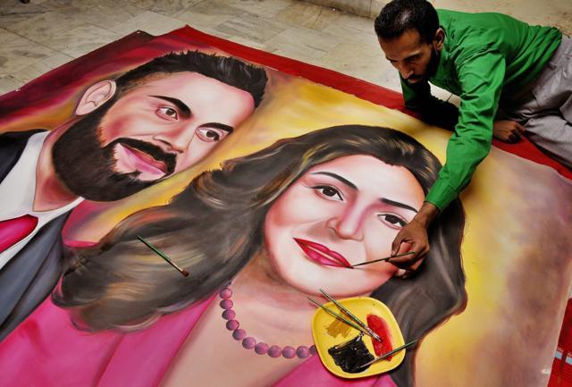 This painting of Virat Kohli and Anushka Sharma was made to greet them on their wedding in Amritsar. (PTI) This painting of Virat Kohli and Anushka Sharma was made to greet them on their wedding in Amritsar. (PTI)