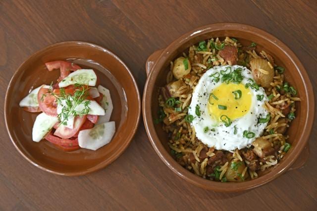 Every Goan Catholic home has their version of a choriz pulao, and O Pedro’s version suffers not on account of flavour, but because of the hard cubes of bacon. It might work better with just pieces of pork. (Shashi S Kashyap / HT Photo)