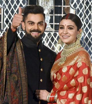 Indian cricket team captain, Virat Kohli and his wife actress Anushka Sharma during their wedding reception, in New Delhi on Thursday. (PTI) Indian cricket team captain, Virat Kohli and his wife actress Anushka Sharma during their wedding reception, in New Delhi on Thursday. (PTI)