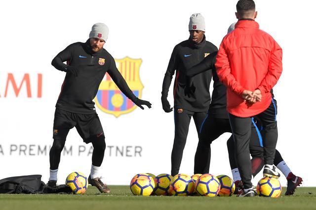 FC Barcelona's Lionel Messi (L) and Ousmane Dembele (R) take part in a training session. (AFP) FC Barcelona's Lionel Messi (L) and Ousmane Dembele (R) take part in a training session. (AFP)