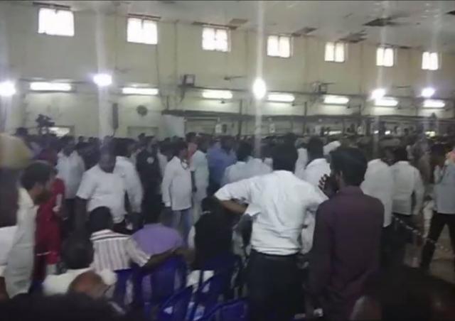 Election officials wait for the disturbance to settle down before resuming counting of votes, at Queen Mary’s College in Chennai. (ANI/Twitter)