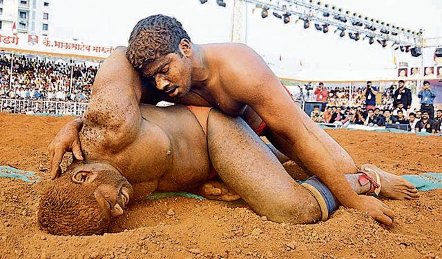 Anil Jadhav (red ribbon) of Karmala, who was injured during a wrestling match. (Shankar Narayan/HT PHOTo)