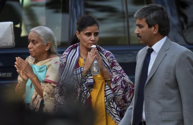 The wife, centre, and mother, left, of Jadhav gesture to the media. (AP) The wife, centre, and mother, left, of Jadhav gesture to the media. (AP)