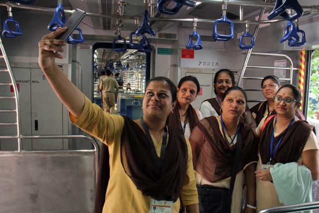 Travel Ticket Examiners (TTE) click a selfie inside the AC local train. (Pramod Thakur/HT) Travel Ticket Examiners (TTE) click a selfie inside the AC local train. (Pramod Thakur/HT)