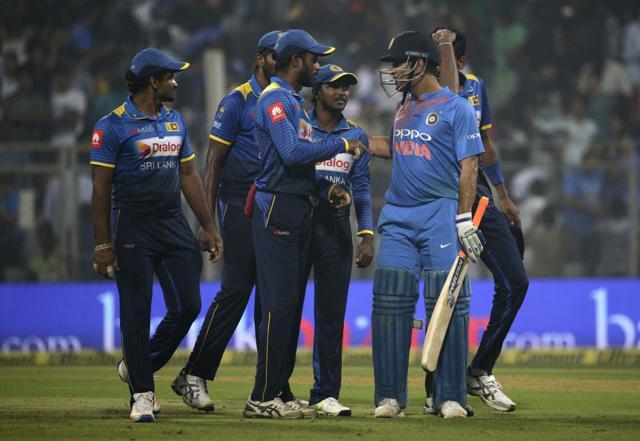 MS Dhoni, second right, interacts with Sri Lanka players at the end of their 3rd ODI encounter in Mumbai. (AP) MS Dhoni, second right, interacts with Sri Lanka players at the end of their 3rd ODI encounter in Mumbai. (AP)