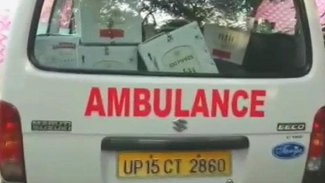 Liquor cartons stored in an ambulance van. (Photo tweeted by ANI) Liquor cartons stored in an ambulance van. (Photo tweeted by ANI)