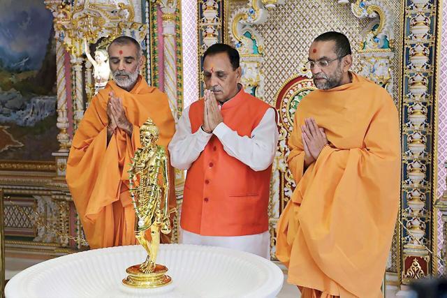 Gujarat chief minister Vijay Rupani offers prayer at the Akshardham Temple ahead of his swearing-in ceremony in Gandhinagar on Tuesday. (PTI Photo) Gujarat chief minister Vijay Rupani offers prayer at the Akshardham Temple ahead of his swearing-in ceremony in Gandhinagar on Tuesday. (PTI Photo)