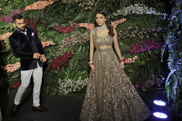 Virat Kohli and Anushka Sharma at their wedding reception in Mumbai on December 26, 2017. The couple got married at a heritage resort in the Italian countryside of Tuscany on December 11. (AP)