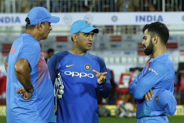 Mahendra Singh Dhoni, Virat Kohli captain of India with India head coach Ravi Shastri during the 3rd T20 match between India and New Zealand at the Greenfield Stadium, Thiruvananthapuram on November 7, 2017. (BCCI) Mahendra Singh Dhoni, Virat Kohli captain of India with India head coach Ravi Shastri during the 3rd T20 match between India and New Zealand at the Greenfield Stadium, Thiruvananthapuram on November 7, 2017. (BCCI)