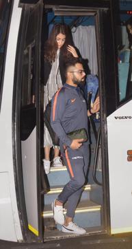 Indian cricket team captain Virat Kohli along with his wife Anushka Sharma deboard the team bus. (PTI) Indian cricket team captain Virat Kohli along with his wife Anushka Sharma deboard the team bus. (PTI)