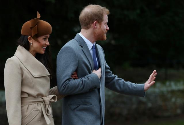 Britain's Prince Harry and his fiancee Meghan Markle leave St Mary Magdalene's church after the Royal Family's Christmas Day service. (REUTERS)