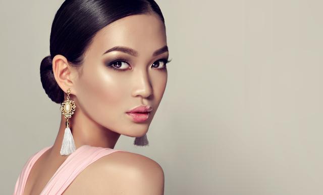 Team black basics like jumpsuits with statement gold tassel earrings. (Shutterstock) Team black basics like jumpsuits with statement gold tassel earrings. (Shutterstock)