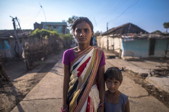 Mangala Pawar, 28, seen here with her daughter, lost her husband Gajanan to a tigress attack in August. (Pratik Chorge / HT Photo)