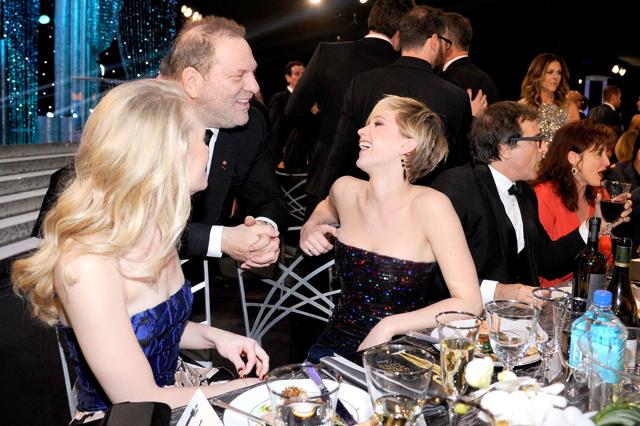 This file photo taken on January 18, 2014 shows Producer Harvey Weinstein (C) and actor Jennifer Lawrence (R) in the audience during the 20th Annual Screen Actors Guild Awards at The Shrine Auditorium in Los Angeles, California. (AFP)