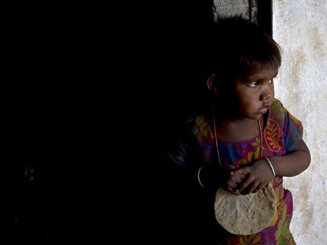 A girl holds a roti in her hand, served as a part of mid-day meal programme, at Madkheda, Madhya Pradesh. (AP File) A girl holds a roti in her hand, served as a part of mid-day meal programme, at Madkheda, Madhya Pradesh. (AP File)