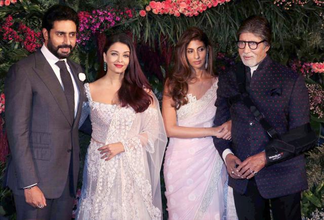Amitabh Bachchan with Abhishek Bachchan, Aishwarya Rai Bachchan and Shweta Nanda arrive for the wedding reception of Virat Kohli and Anushka Sharma in Mumbai. (PTI) Amitabh Bachchan with Abhishek Bachchan, Aishwarya Rai Bachchan and Shweta Nanda arrive for the wedding reception of Virat Kohli and Anushka Sharma in Mumbai. (PTI)