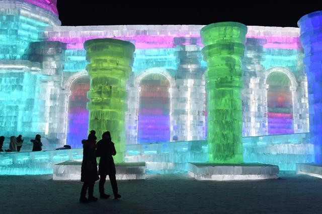 Visitors walk past an ice sculpture on the opening day of the annual Harbin Ice and Snow Sculpture Festival. (AFP) Visitors walk past an ice sculpture on the opening day of the annual Harbin Ice and Snow Sculpture Festival. (AFP)