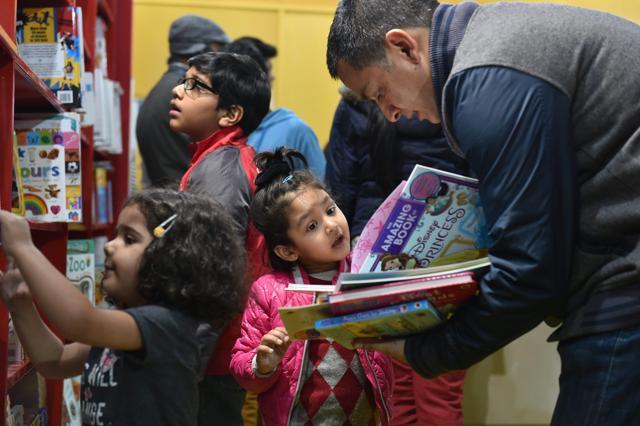 Children wade through books at New Delhi World Book Fair held near Pragati Maidan in New Delhi. (PTI) Children wade through books at New Delhi World Book Fair held near Pragati Maidan in New Delhi. (PTI)