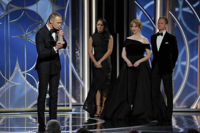 Alexander Skarsgard, left, accepting the award for best performance by a supporting actor in a series, limited series of film made for TV for his role in Big Little Lies. (AP)