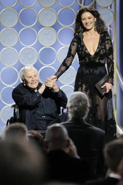 This image released by NBC shows presenters Kirk Douglas, left, and Catherine Zeta Jones at the 75th Annual Golden Globe Awards in Beverly Hills, Calif., on Sunday, Jan. 7, 2018. (AP)