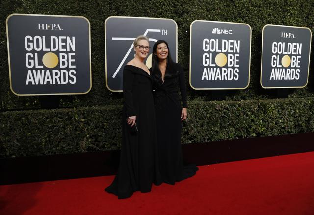 Meryl Streep (L) and the director of the National Domestic Workers Alliance, Ai-jen Poo. (REUTERS)