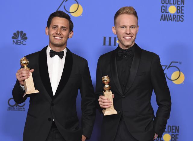 Benj Pasek, left, and Justin Paul pose in the press room with the award for best original song - motion picture for "This Is Me" from "The Greatest Showman". (Jordan Strauss/Invision/AP)