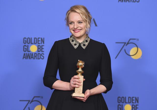 Elisabeth Moss poses in the press room with the award for best performance by an actress in a television series - drama for The Handmaid's Tale. (Jordan Strauss/Invision/AP)