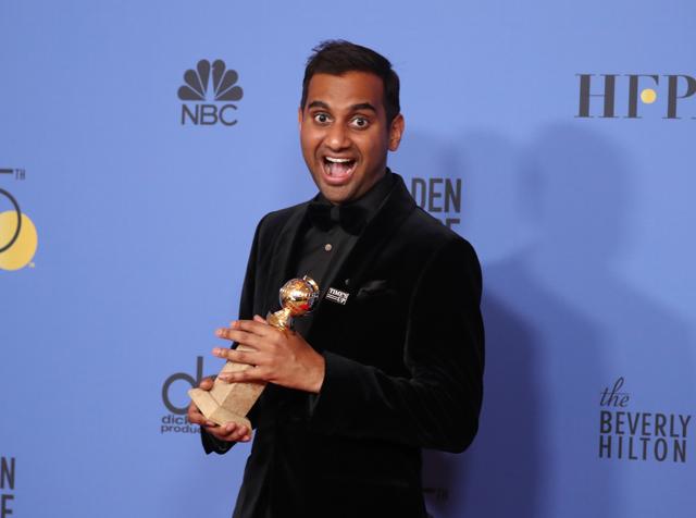 Aziz Ansari poses with the award for Best Performance by an Actor in a Television Series. (REUTERS)